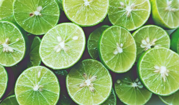 Lime Background. Close up shot of limes. Selective Focus of slic